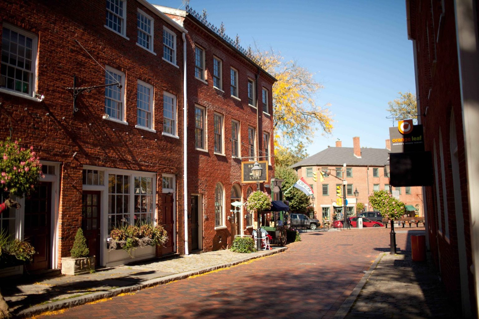 Downtown Newburyport. Colonial style brick buildings with brick streets and flower windowboxes in the windows of the buildings